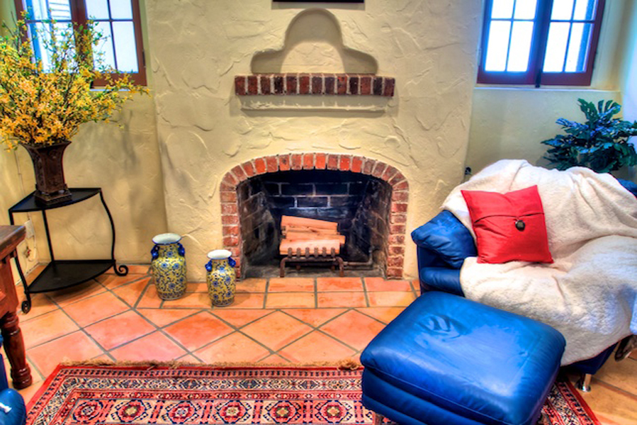 1010 Garcia Road Santa Barbara, CA 93103 - Photo 14 of 20 a living room with furniture and a fireplace