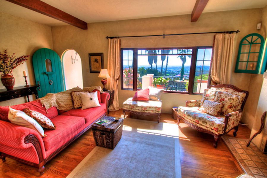 1010 Garcia Road Santa Barbara, CA 93103 - Photo 3 of 20 a living room with furniture a couch and large windows