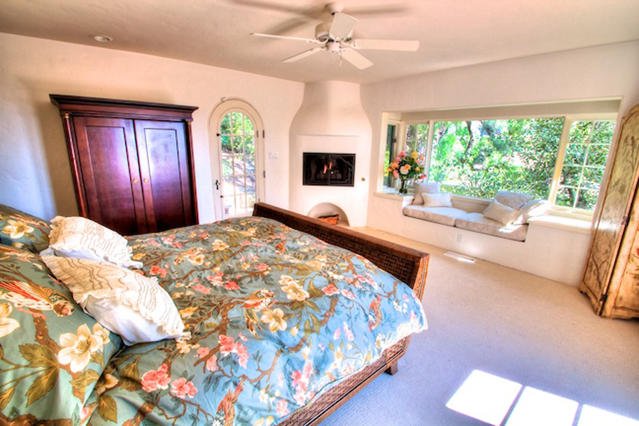 1010 Garcia Road Santa Barbara, CA 93103 - Photo 8 of 20 a bed sitting in a spacious bedroom next to a window