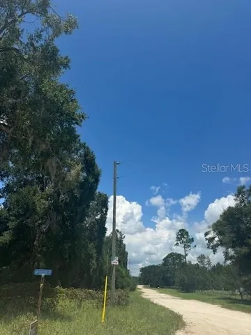 a view of a lake with a yard