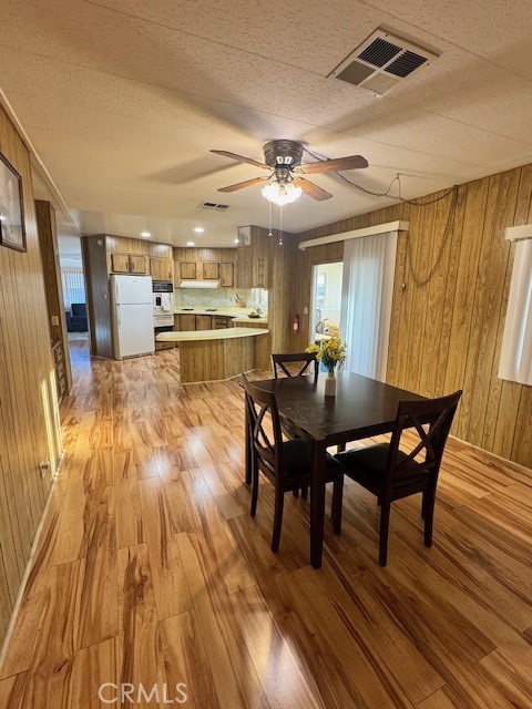 975 California Street, Unit 8 Calimesa, CA 92320 - Photo 11 of 19 a view of a dining room with furniture and wooden floor