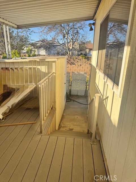 975 California Street, Unit 8 Calimesa, CA 92320 - Photo 17 of 19 a view of a balcony with wooden floor