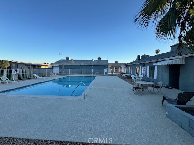 975 California Street, Unit 8 Calimesa, CA 92320 - Photo 19 of 19 a view of a swimming pool with a lounge chair