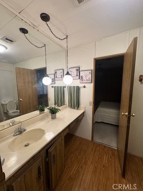 975 California Street, Unit 8 Calimesa, CA 92320 - Photo 8 of 19 a bathroom with a sink a mirror and a shower