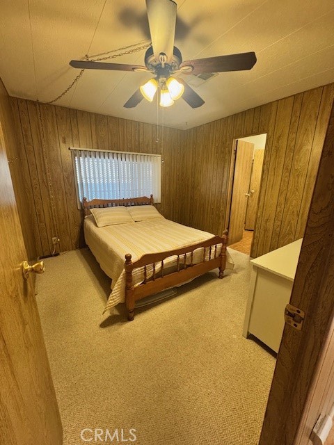 975 California Street, Unit 8 Calimesa, CA 92320 - Photo 9 of 19 a bedroom with a bed and table