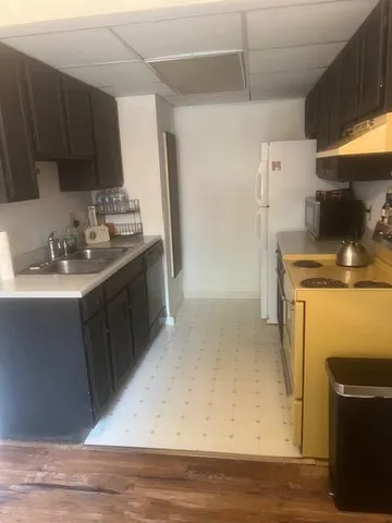 a kitchen with a stove and a refrigerator