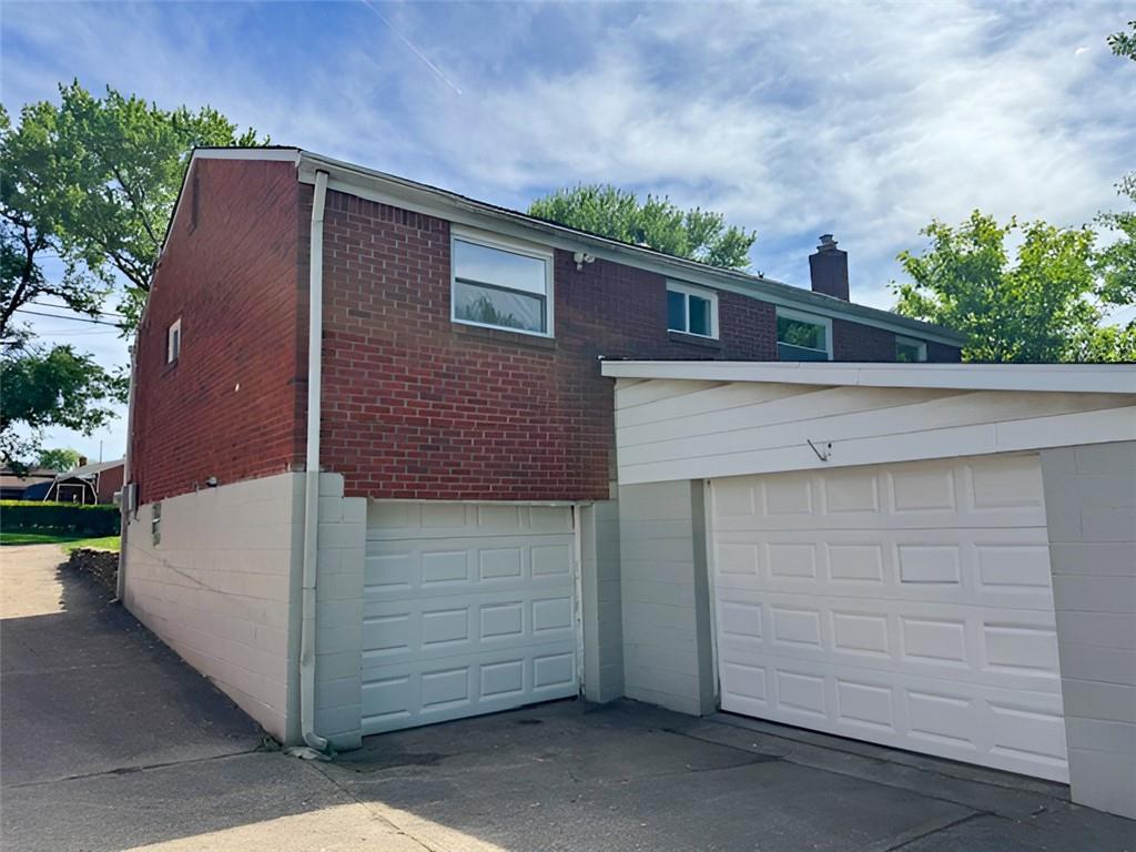 279 Olympic Road Pittsburgh, PA 15236 - Photo 25 of 25 a front view of a house with a garage