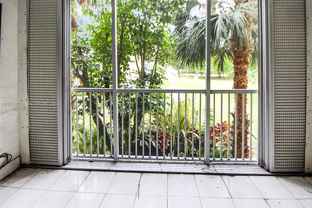 a view of a porch with a floor to ceiling window