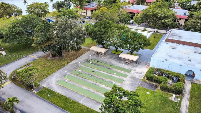 an aerial view of a house with yard swimming pool and outdoor seating