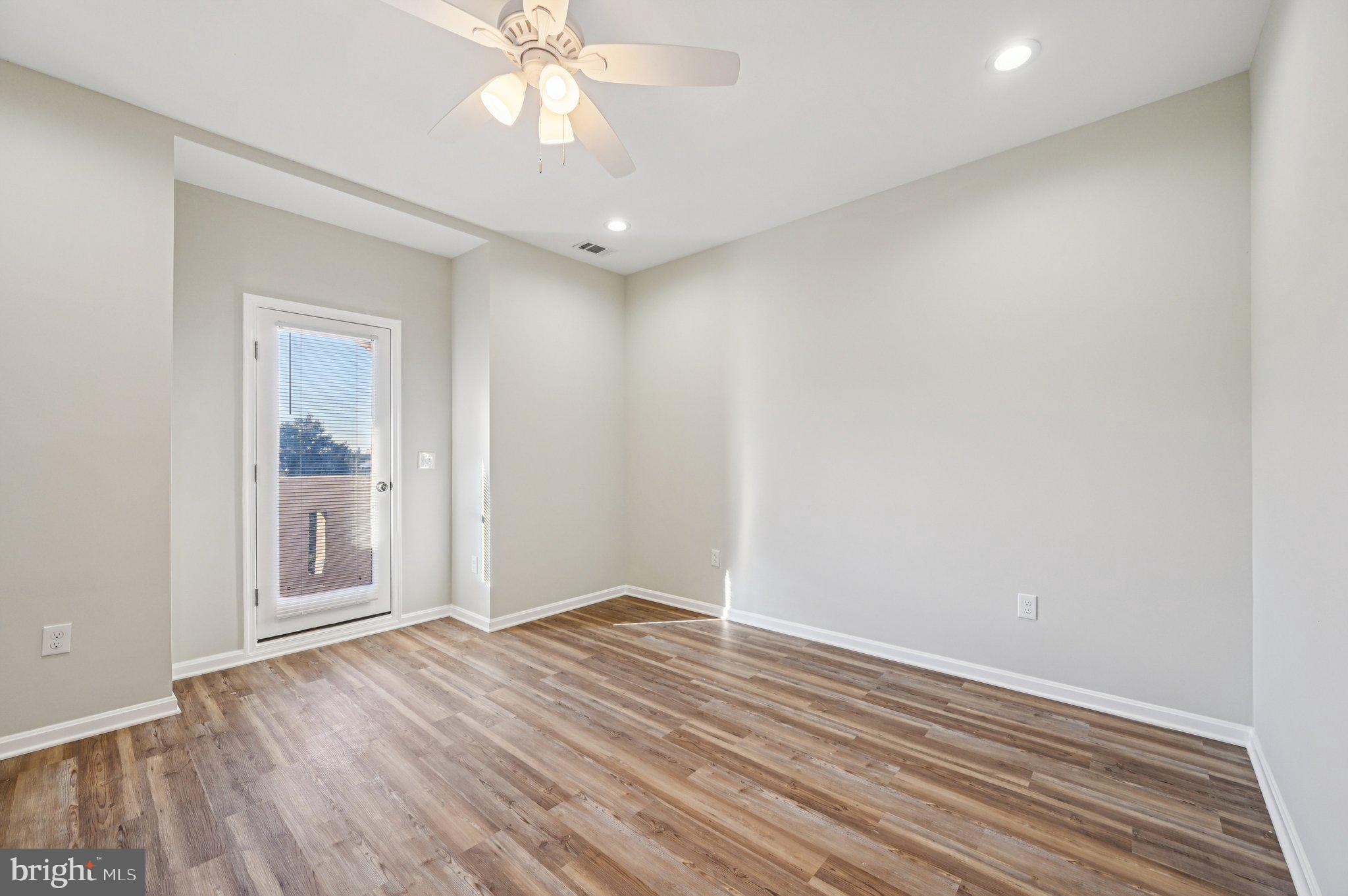 750 Reservoir Street, Unit C Baltimore, MD 21217 - Photo 15 of 25 wooden floor in an empty room with a window