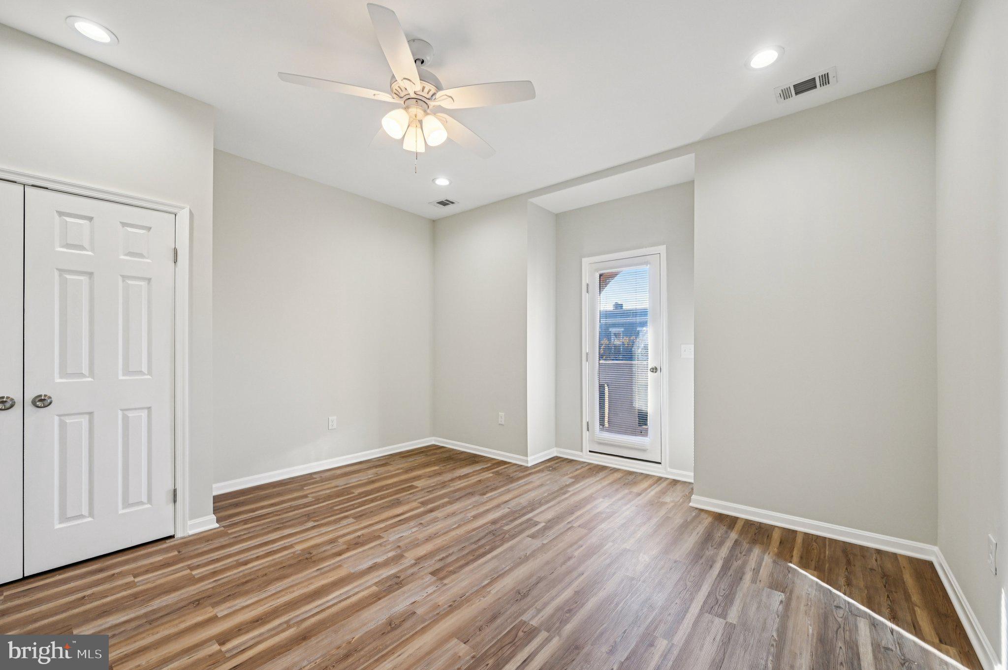 750 Reservoir Street, Unit C Baltimore, MD 21217 - Photo 16 of 25 a view of an empty room with wooden floor