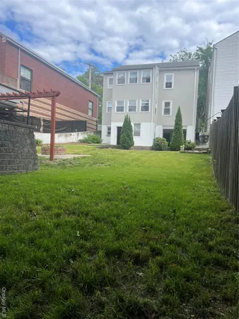 a view of a backyard with potted plants