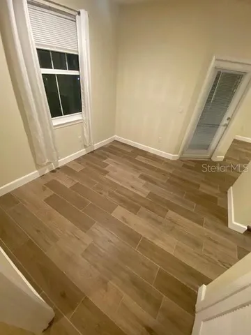 a view of an empty room with a window