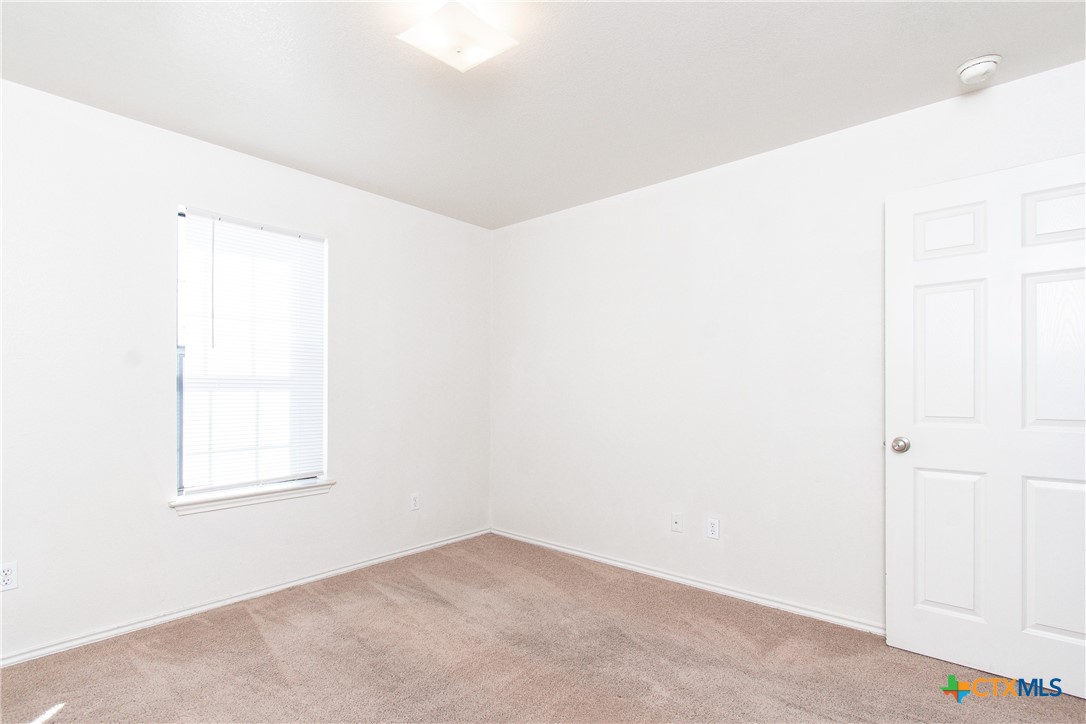 405 Bermuda Street, Unit B Copperas Cove, TX 76522 - Photo 11 of 13 an empty room with windows
