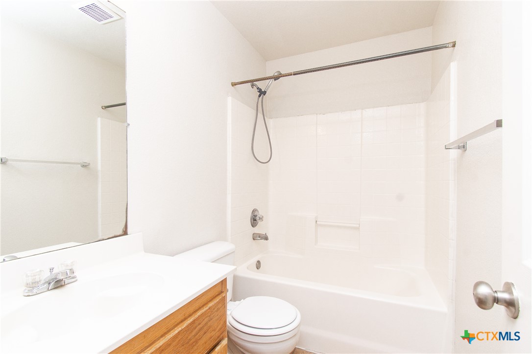 405 Bermuda Street, Unit B Copperas Cove, TX 76522 - Photo 9 of 13 a bathroom with a sink a toilet and a bathtub