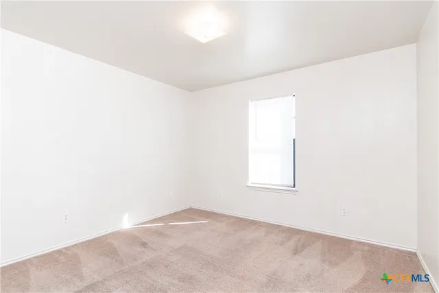 a view of a brick house with a yard