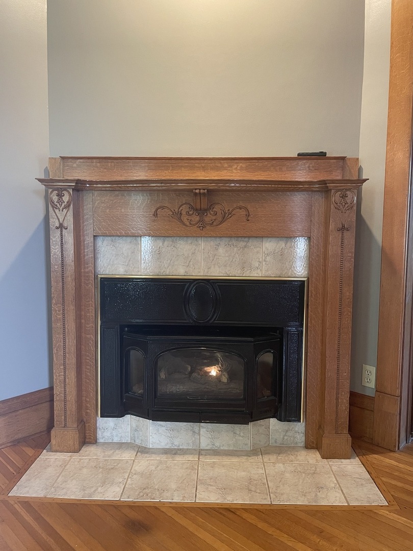 322 Crawford Avenue Dixon, IL 61021 - Photo 13 of 44 a fireplace with a hallway