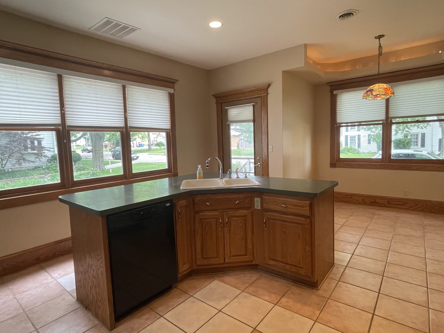 322 Crawford Avenue Dixon, IL 61021 - Photo 19 of 44 a kitchen with stainless steel appliances granite countertop a refrigerator and a sink