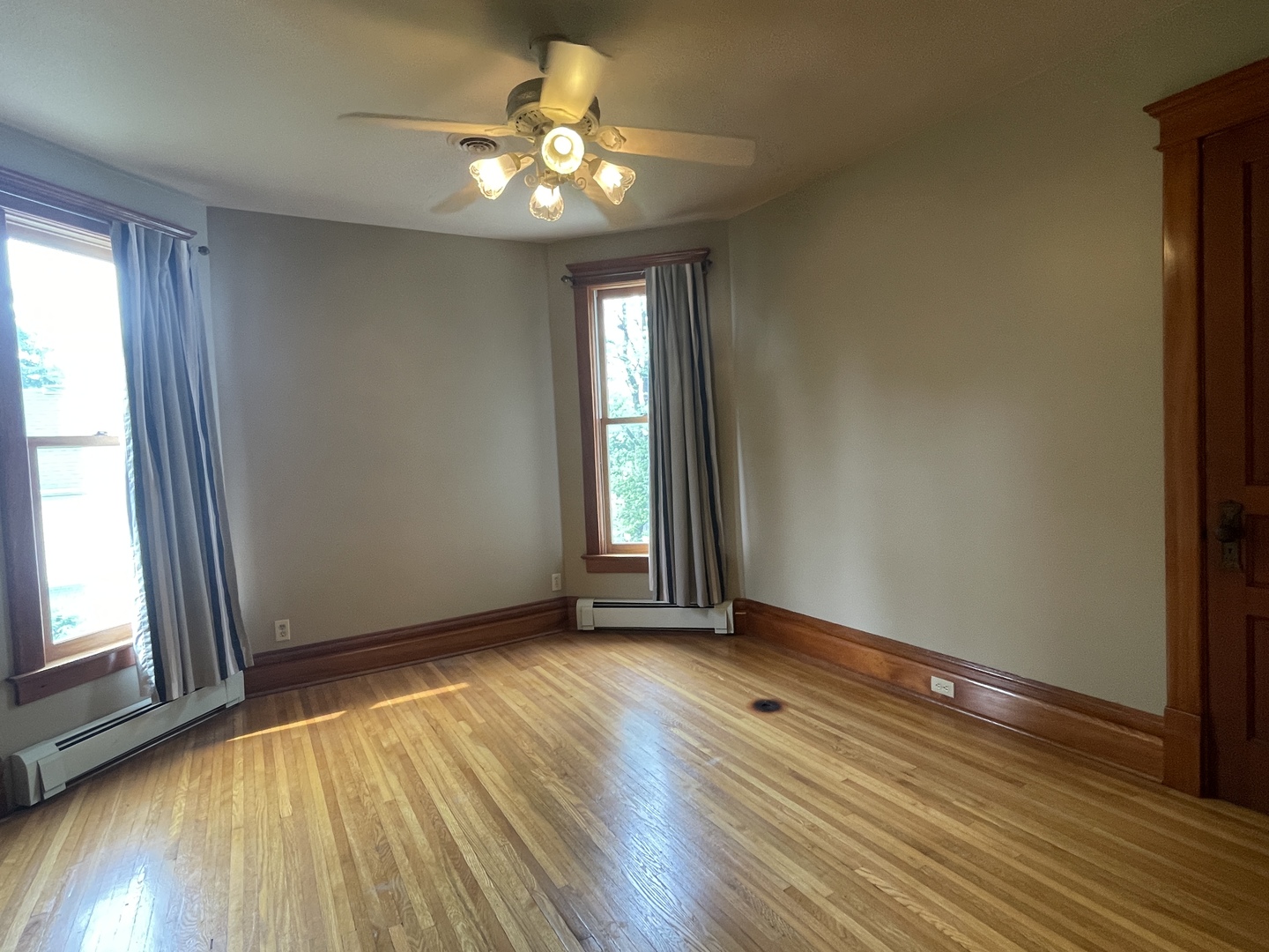 322 Crawford Avenue Dixon, IL 61021 - Photo 32 of 44 a view of an empty room with wooden floor and a window