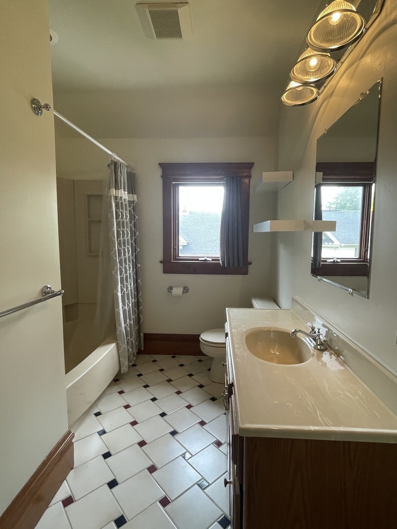 322 Crawford Avenue Dixon, IL 61021 - Photo 34 of 44 a bathroom with a sink a toilet and shower