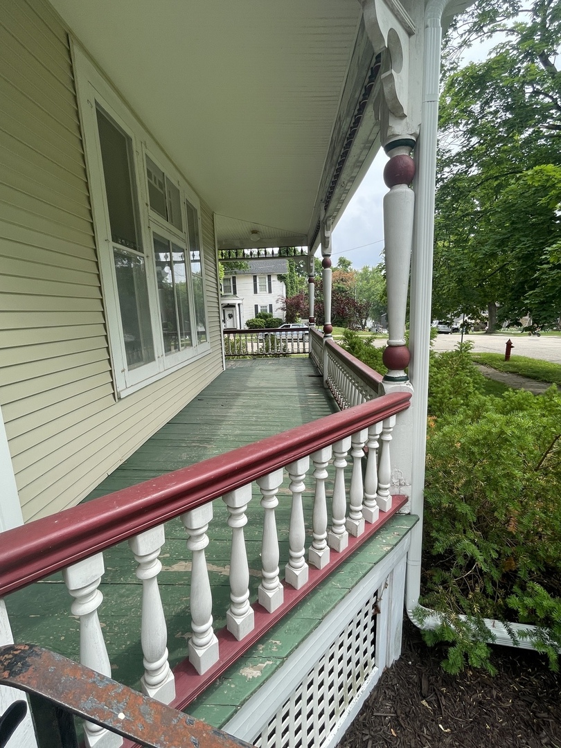 322 Crawford Avenue Dixon, IL 61021 - Photo 5 of 44 a view of a balcony with chairs
