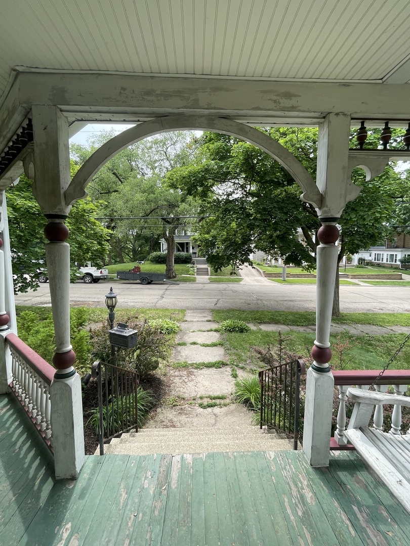 322 Crawford Avenue Dixon, IL 61021 - Photo 8 of 44 a view of a porch with furniture and garden