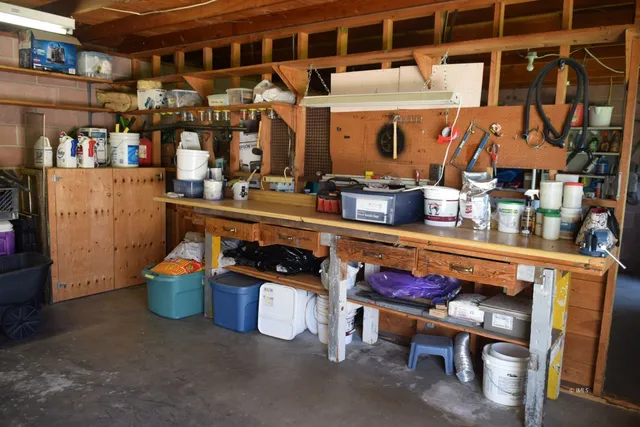 a view of backyard with cabin and wooden fence