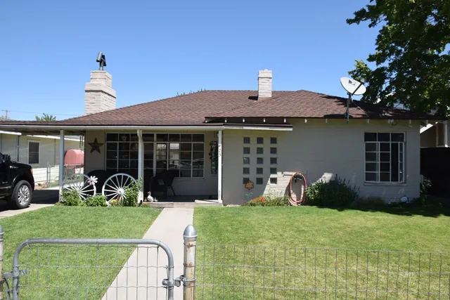 a front view of a house with garden and porch