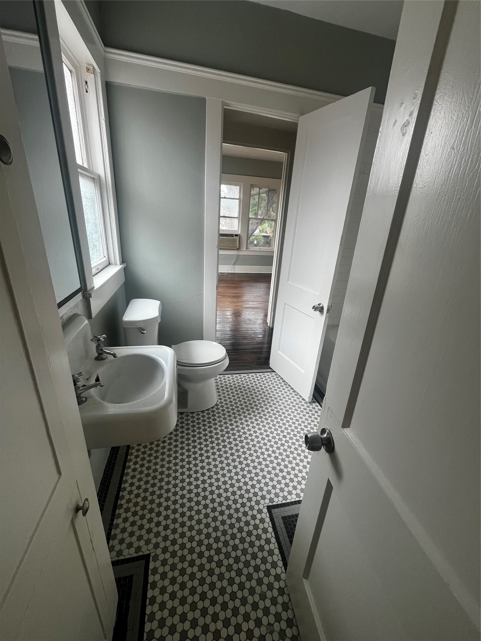 1711 West Main Street, Unit 3 Houston, TX 77098 - Photo 4 of 11 a bathroom with a sink toilet and shower