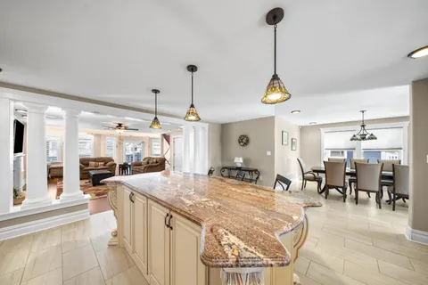 a kitchen with granite countertop cabinets and stainless steel appliances