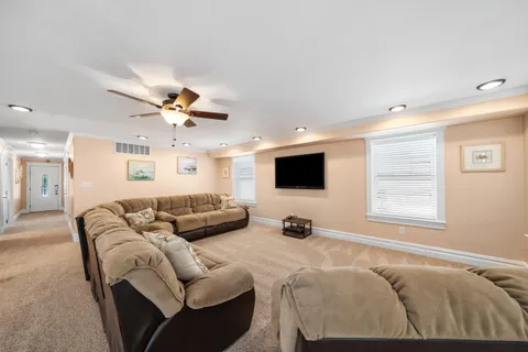 a spacious bedroom with a bed and a couch