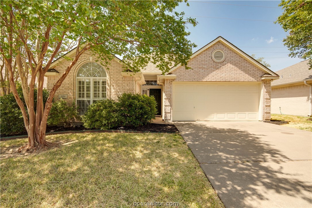 3211 Broadmoor Drive Bryan, TX 77802 - Photo 1 of 1 a front view of a house with a yard and garage