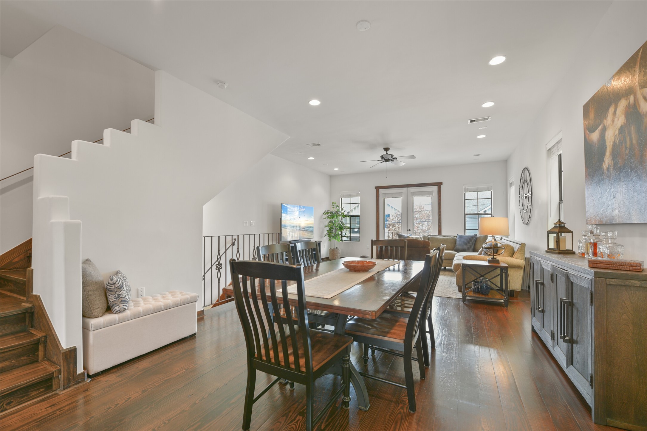 2601 Bevis Street, Unit B Houston, TX 77008 - Photo 6 of 25 Another angle showing the large space for a sizable dining table. The stairs lead to a small landing for the powder room and then up to the primary bedroom and a secondary bedroom.