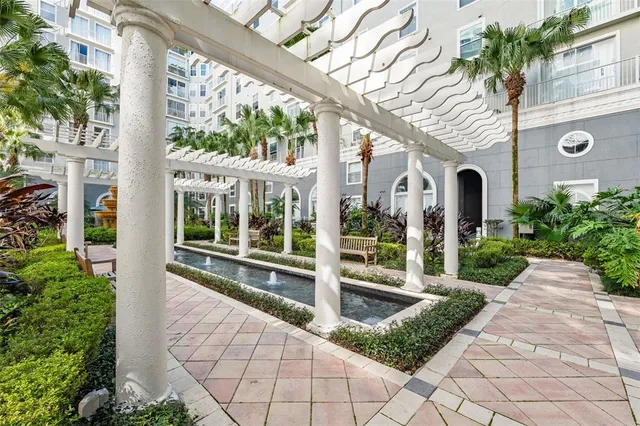 a view of a garden with a building