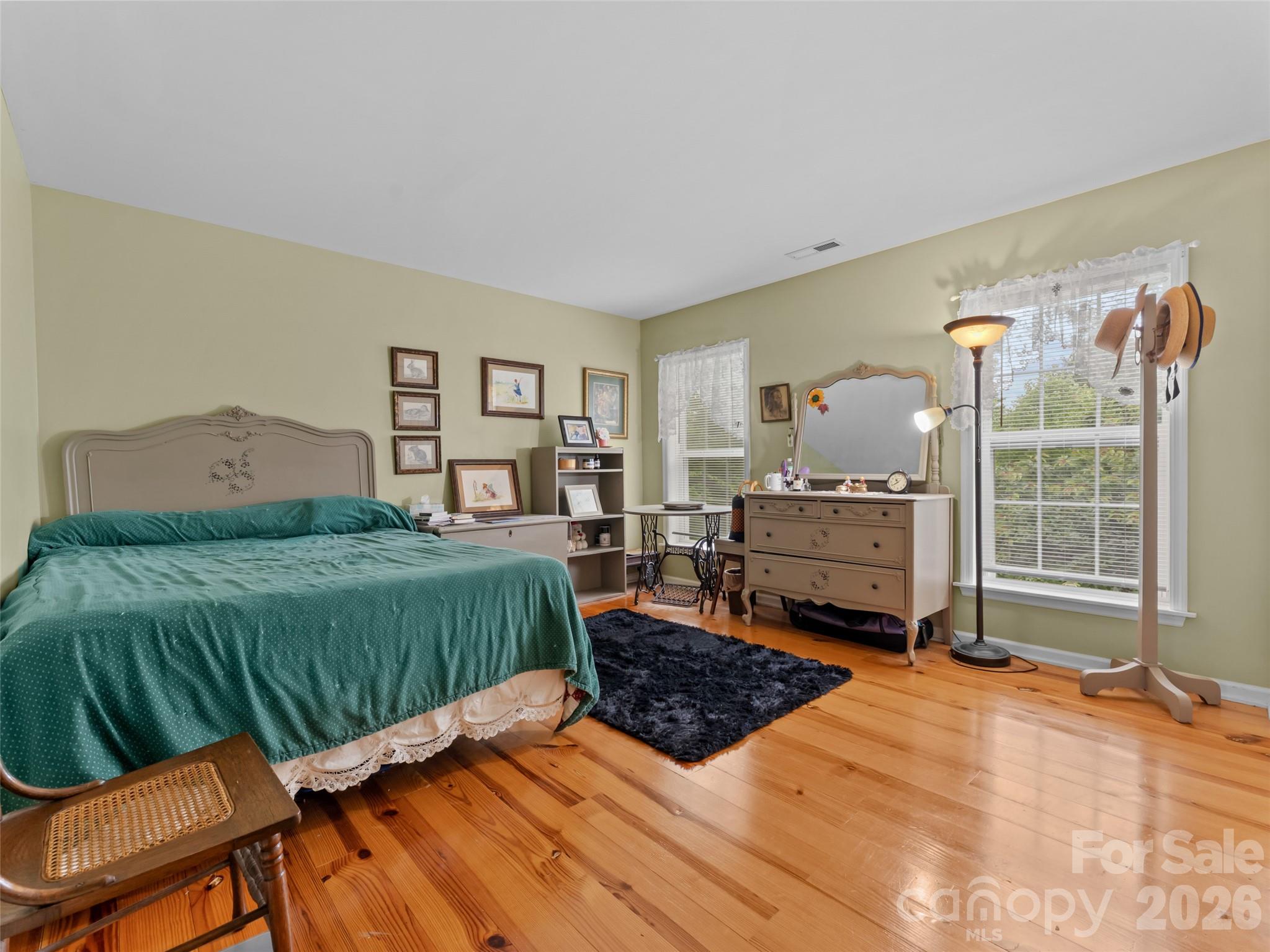 103 Old Southside Road Saluda, NC 28773 - Photo 38 of 48 a bedroom with a bed and wooden floor