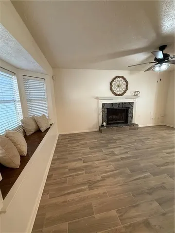 a spacious bedroom with a bed and a table