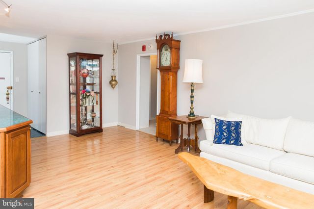 a spacious bedroom with a bed and a couch