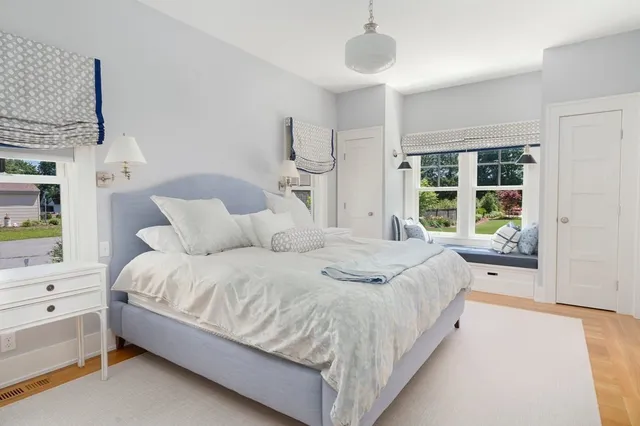 a kitchen with stainless steel appliances granite countertop a sink white cabinets and a granite counter tops