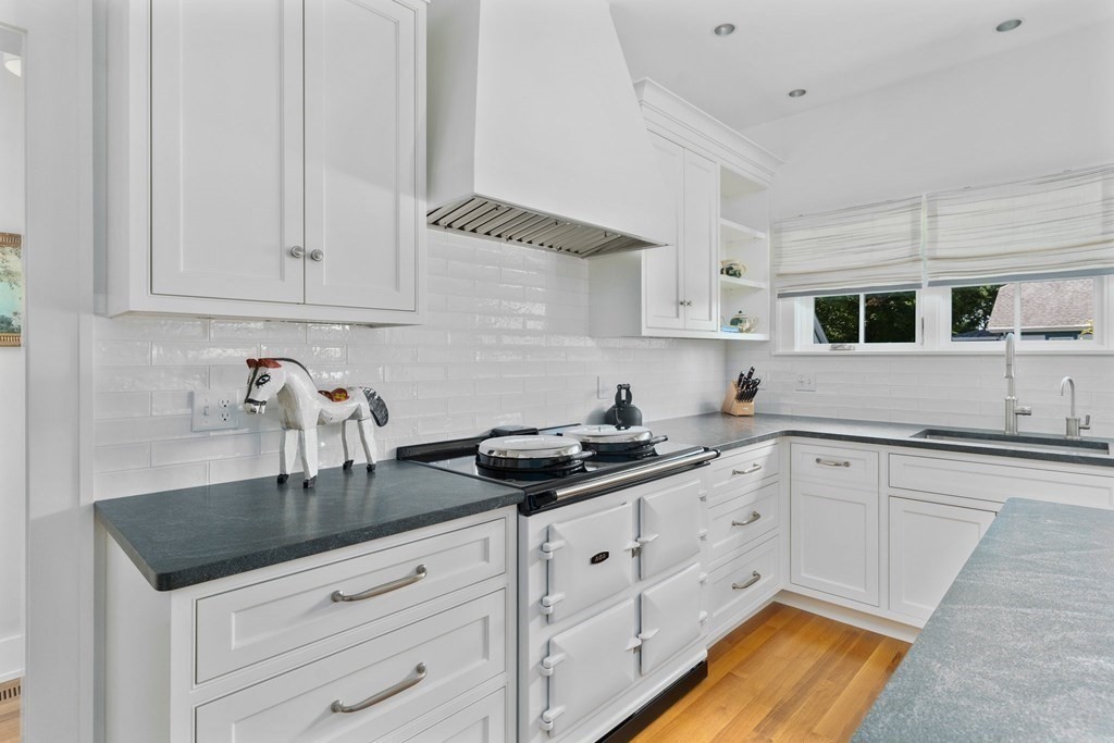 23 Bay State Road Rehoboth, MA 02769 - Photo 35 of 42 a kitchen with stainless steel appliances granite countertop a sink white cabinets and a granite counter tops