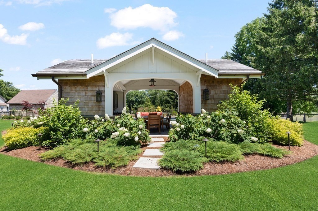 23 Bay State Road Rehoboth, MA 02769 - Photo 36 of 42 a front view of a house with a yard and potted plants