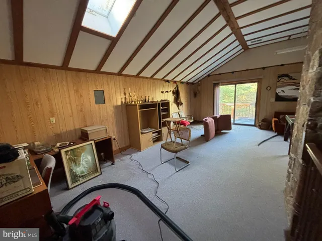 a living room with furniture a rug and a table