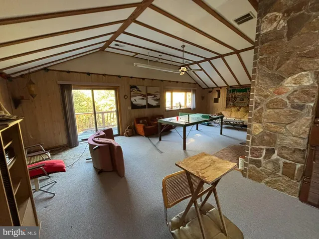 a bedroom with bed and a chandelier