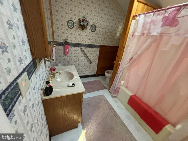 a bedroom with bed and a window