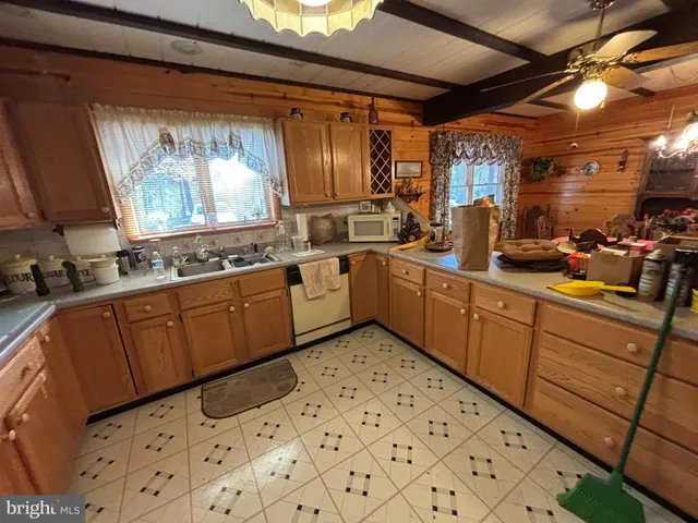 a kitchen with sink cabinets and window