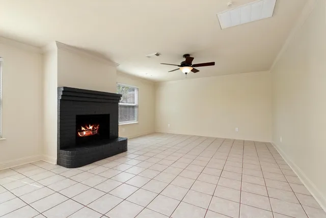 a view of an empty room with fire place