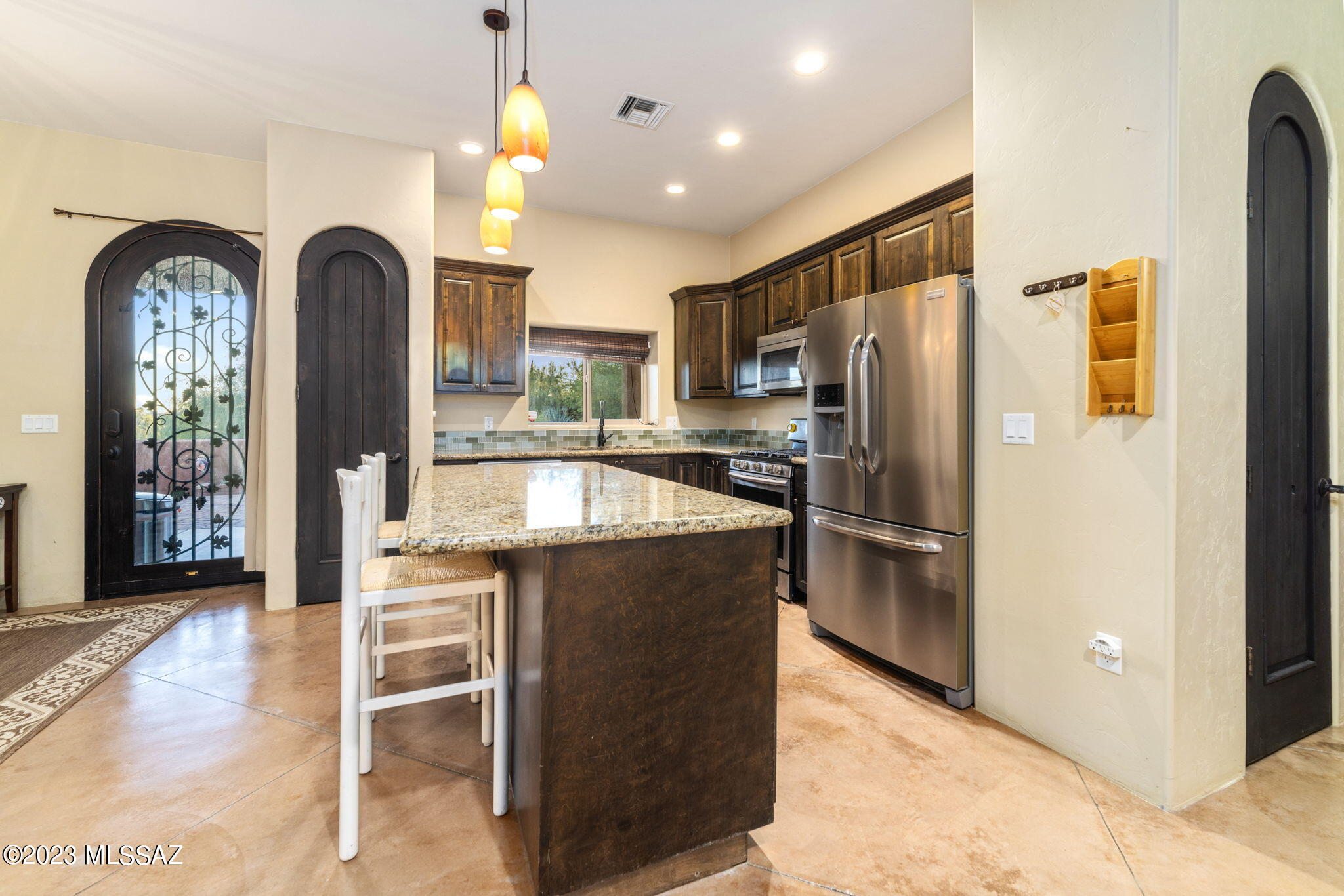 5670 Triangle X Place Tucson, AZ 85713 - Photo 1 of 36 a kitchen with refrigerator a sink and cabinets