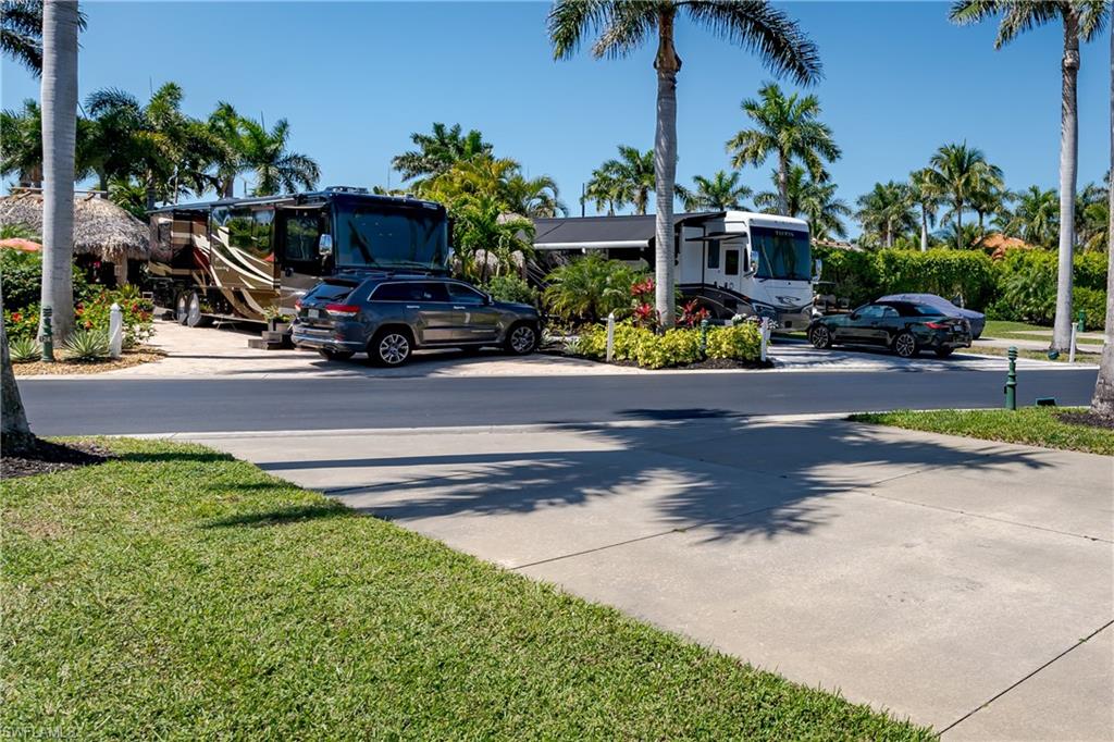 13594 Snapper Lane Naples, FL 34114 - Photo 18 of 29 a car parked on the side of the road