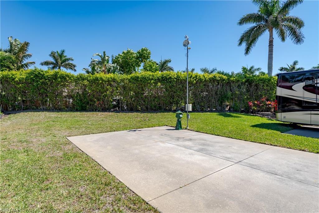 13594 Snapper Lane Naples, FL 34114 - Photo 21 of 29 a view of a backyard with palm trees