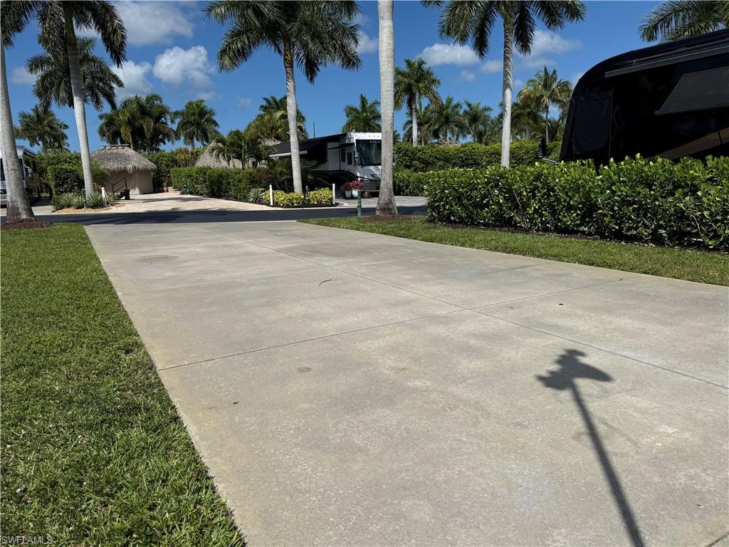 13594 Snapper Lane Naples, FL 34114 - Photo 4 of 29 front view of a house with a yard