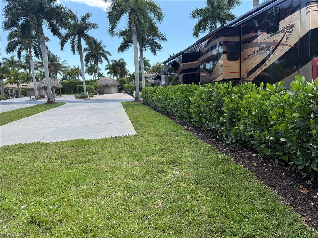13594 Snapper Lane Naples, FL 34114 - Photo 10 of 29 a front view of house with yard and green space